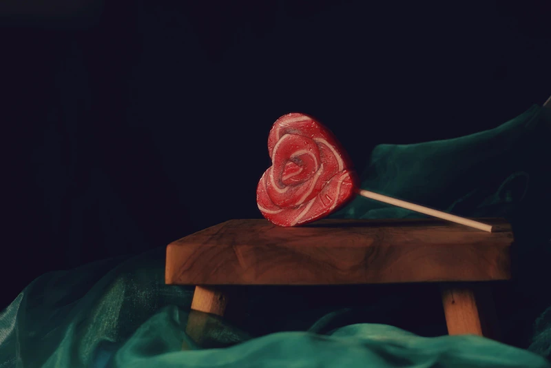 a piece of meat sitting on top of a wooden table